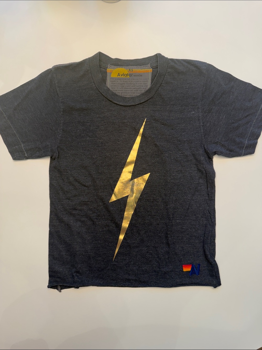 Aviator Nation Black Tee with Gold Lightning Bolt Graphic